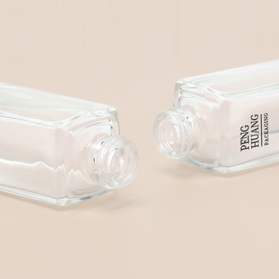 Estampado en caliente del paquete cosmético de la botella de la bomba de cristal de la base líquida 30ml