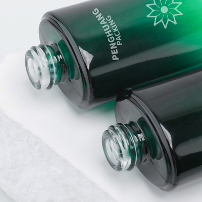 la botella de la loción del vidrio de la belleza 55ml heló la loción que el regalo cosmético de la botella fijó el verde de empaquetado de Skincare
