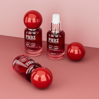 Botella de vidrio vacía de 30 ml / 1 oz con gradiente rojo y tapa de bola redonda, empaque personalizado de color OEM ODM para cuidado de la piel para loción y aceite esencial
