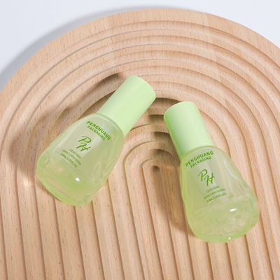 Botellas de aguacate verde transparente de 30 ml de vidrio de base líquida para el envase de cuidado de la piel