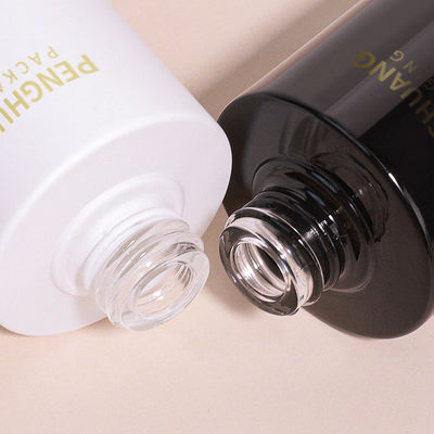 Botella cuentagotas redonda de vidrio con logotipo personalizado según los requisitos del cliente