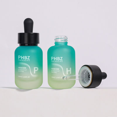 Botella de goteo de vidrio redonda de 30 ml Botella de suero de aceite diseñada para aceites esenciales para el cuidado de la piel y necesidades de envasado cosmético