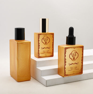 Botella de cristal modificada para requisitos particulares del dropper del aceite esencial del aceite 30ml 50ml 100ml del oro del suero de lujo vacío cosmético del cuadrado