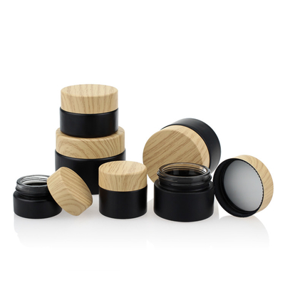 Negro de bambú de empaquetado cosmético Matte Glass Jars 50g del tapón de tuerca del color del sistema