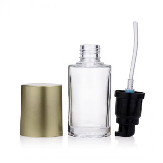 Botella de empaquetado cosmética de lujo de la fundación de la botella de vidrio 40ML con la bomba del oro para el maquillaje