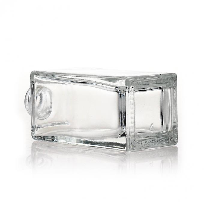 La botella de cristal cosmética clara del cuadrado vacío 35ml heló la botella de vidrio líquida de la bomba de la fundación del maquillaje
