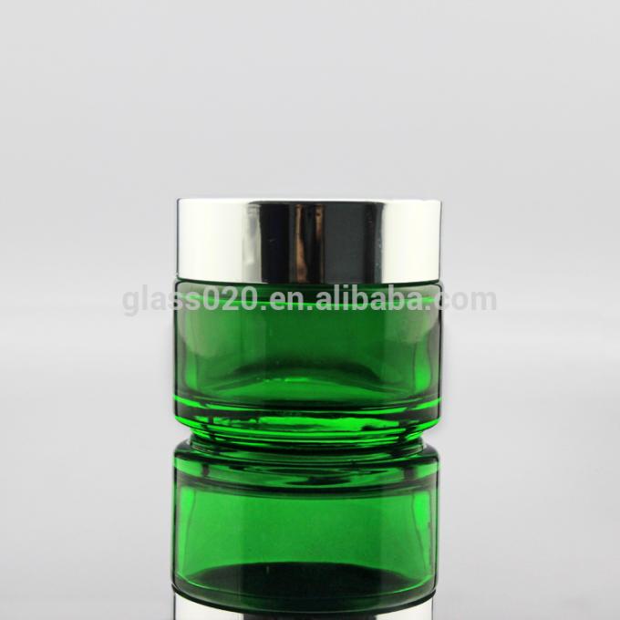 Al por mayor tarro poner crema cosmético de cristal verde vacío 5 10 15 20 30 50 100g con la tapa de plata